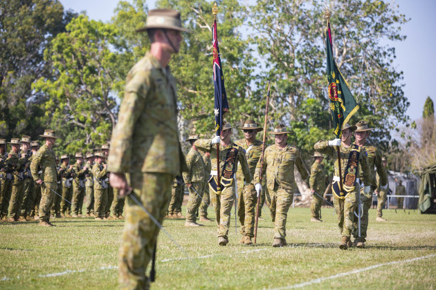 Australian Army soldiers and officers from 51st Battalion, Far North Queensland Regiment march on the Queens and Regimental Colours during a parade celebrating the formatin of Regional Force Surveillance Group at Larrakeyah Barracks, Darwin. (Defence)