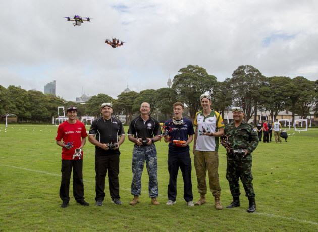L-R: British Army member, Gunner Liam Seckam; New Zealand Army soldier, Sergeant Garry Wilson; Royal Australian Air Force member, Corporal Steven Duncan; Royal Navy sailor, Able Seaman James Payne; Australian Army soldier, Lance Corporal Cameron Webster; and Royal Thai Army soldier, Corporal Metha Yupanit; practice drone flying techniques together during the International Drone Racing Tournament at Victoria Barracks, Sydney. Defence