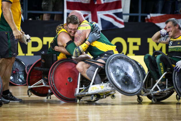 Australian Invictus Games wheelchair rugby players Jamie Tanner and Peter Arbuckle, celebrate beating the United Kingdom during the wheelchair rugby final at Sydney Olympic Park. Defence