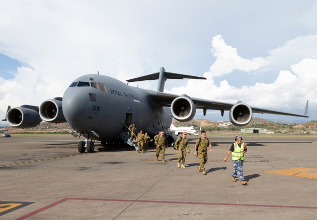 Personnel deploying on Operation APEC 18 Assist disembark a Royal Australian Air Force C-17 Globemaster. Credit: Defence