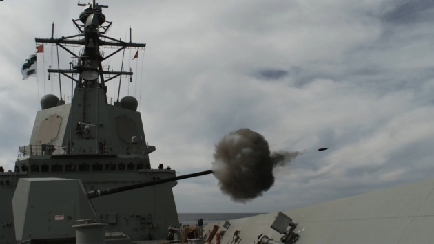 HMAS Hobart&rsquo;s 45 Inch gun is fired at a target during test firing. (Defence)