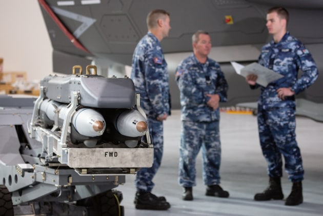 Flying Officer Matthew Walker (right) delivers GBU-39/B Small Diameter Bomb familiarisation training to Armament Technicians Corporal (CPL) Christopher Sorrensen and CPL Simon McMillan from No 3 Squadron. Credit: Defence