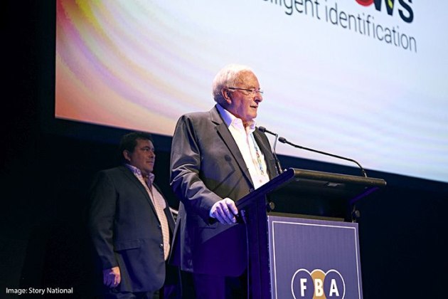 Lester Nichol, founder and chairman of Matthews Australasia, accepts the company's FBA Hall of Fame induction.