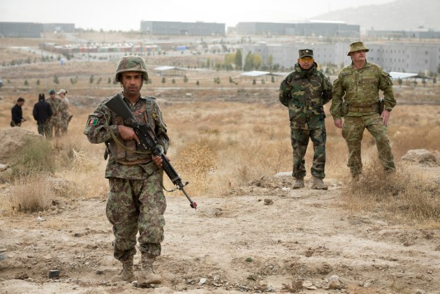 Warrant Officer Class Two David Joliffe observes training with an instructor at the Afghan National Army Officer Academy (ANAOA) during cadet training in the close training area. (Defence)