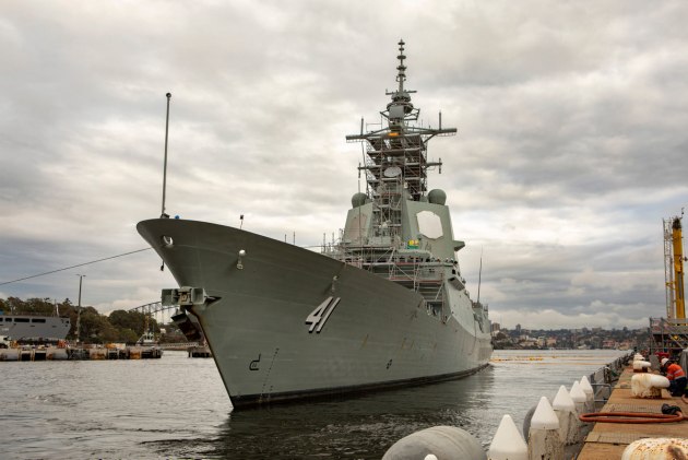 HMAS Brisbane conducts a cold move to the docking maintenance facilities at Garden Island in Sydney. (Defence)