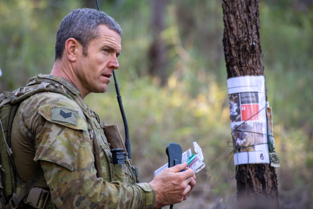 Sergeant Peter Byrnes, from the 8th/9th Battalion RAR receives his next checkpoint over the radio during the navigation serial of Exercise Ramsilience at Gallipoli Barracks, Brisbane. (Defence)