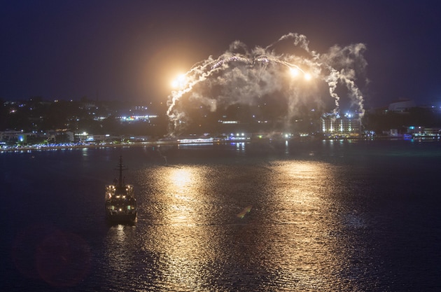 HMAS Choules embarked MRH 90 Taipan, call sign Hat-Trick, deploys chaff and flares in Port Vila as part of the Republic of Vanuatu&rsquo;s 40th Anniversary of Independence celebrations.

Credit: Defence / James McDougall