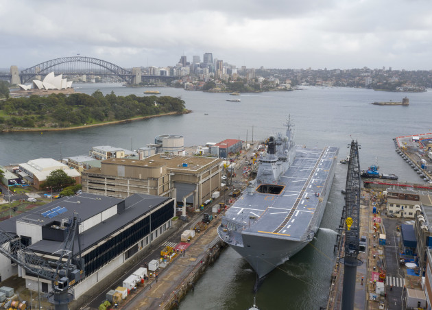 HMAS Canberra departs the Captain Cook dry-dock after an extended maintenance period at Garden Island.