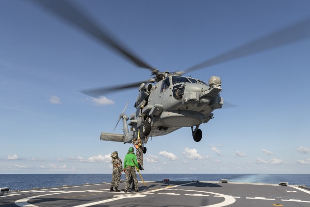 HMAS Parramatta's embarked MH-60R helicopter during flying operations at sea.

Credit: Defence