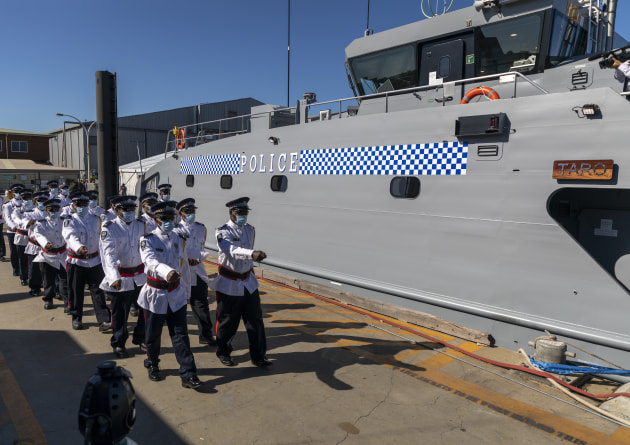 The Ship&rsquo;s company of Royal Solomon Islands Patrol Vessel Taro march along the wharf at AUSTAL Ship Building Facility in Henderson, Western Australia.