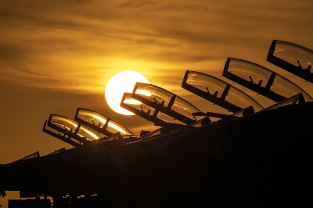 The sun sets behind a row of F/A-18F Super Hornets at RAAF Base Darwin during Exercise Arnhem Thunder 21. (Defence)