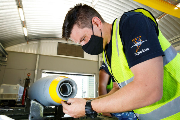 Armament Technician, Corporal Andrew Johnston from No. 3 Squadron, assembles a Guided Bomb Unit (GBU-12) using a new Australian manufactured Bomb Live Unit (BLU 111) at RAAF Base Williamtown, NSW. (Corporal Craig Barrett)
