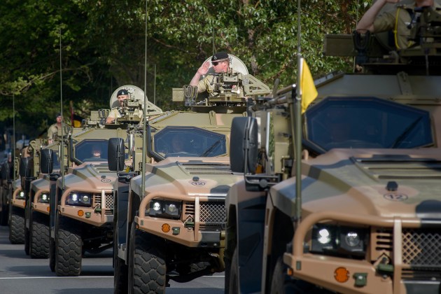 Vehicles of the 10th Light Horse Regiment move through the streets of Perth. (Defence)