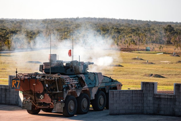 Soldiers from the 2nd/14th Light Horse Regiment (Queensland Mounted Infantry) fire the main armament of a Boxer CRV in the Wide Bay Training Area, Queensland. (Defence)