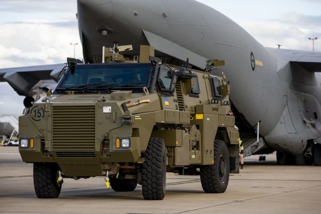 A Bushmaster protected mobility vehicle bound for Ukraine waits to be loaded onto a RAAF C-17A Globemaster III aircraft at RAAF Base Amberley. (Defence)