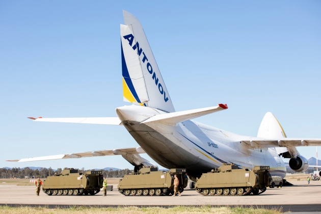 M113AS4 Armoured Personnel Carriers bound for Ukraine, wait to be loaded onto an Antonov An-124 cargo aircraft at RAAF Base Amberley, QLD. (Defence)