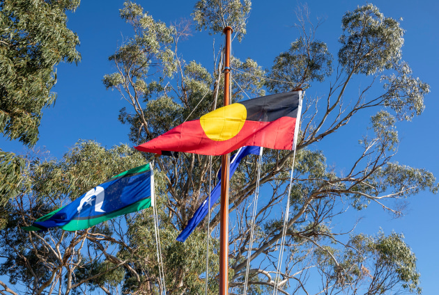 The Australian Aboriginal flag and the Torres Strait Islander flag fly alongside the Australian National Flag. (Defence)