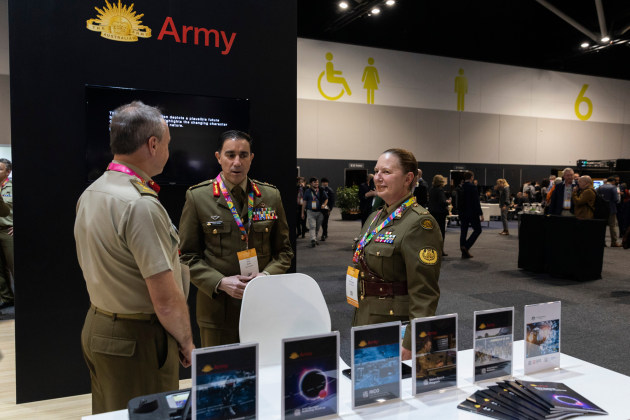 (L-R) Chief of Army, Lieutenant General Simon Stuart, with Regimental Sergeant Major &ndash; Army Warrant Officer Kim Felmingham, talk with members of the Australian Army exhibit at the inaugural ADSTAR at Sydney's International Convention Centre. (Defence)