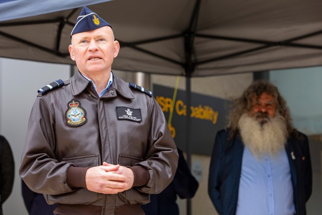 Air Vice-Marshal Leon Phillips addresses attendees during the opening of the MC-55A Interim Operating Facility (IOF) at RAAF Base Edinburgh in September 2022. (Defence)