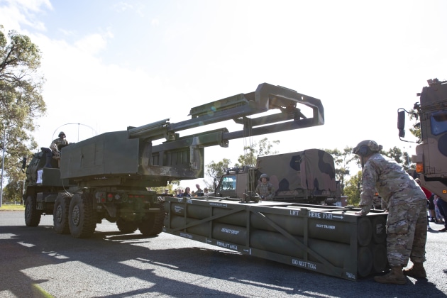 A demonstration rocket pod is loaded onto a High Mobility Artillery Rocket System (HIMARS) launcher during open day at Irwin Barracks, Karrakatta, near Perth in Western Australia.
Credit: Defence