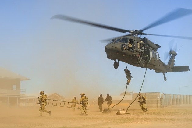 Australian Army soldiers and aviators conduct helicopter insertion and extraction training as part of UH-60M Black Hawk introduction into service activities.

Credit: Defence