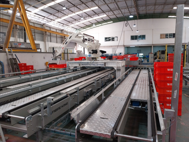 This latest solution integrates two ABB IRB660 palletising robots to service eight production lines.