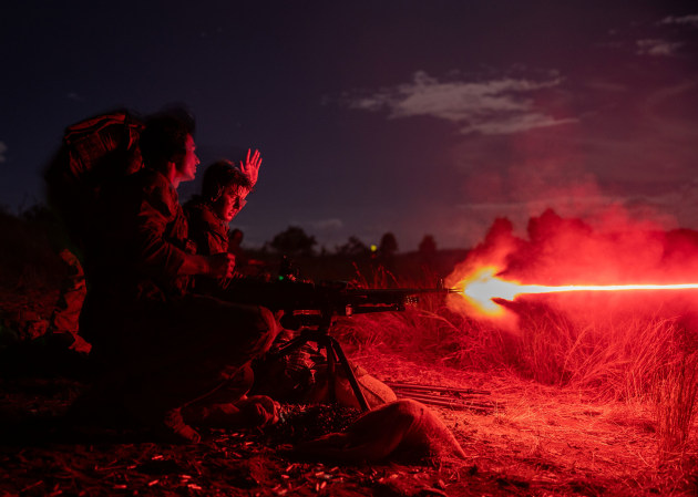 Soldiers from 1RAR firing the MAG 58 at night.

Credit: Defence