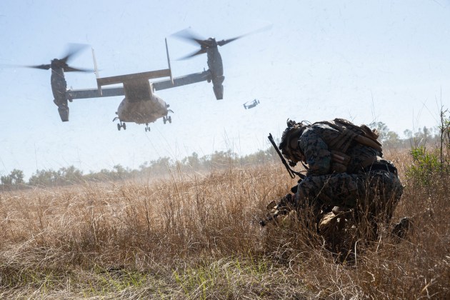 US Marines from Marine Rotational Force-Darwin 22 brace while an MV-22 Osprey takes off during an air assault at Yampi Sound during Exercise Koolendong 2022. (Defence)