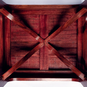 The lapped tips of the giant's arm braces are located with bamboo pins. The gap is required to disassemble the structure and traditionally would have been hidden under an embracing cap.