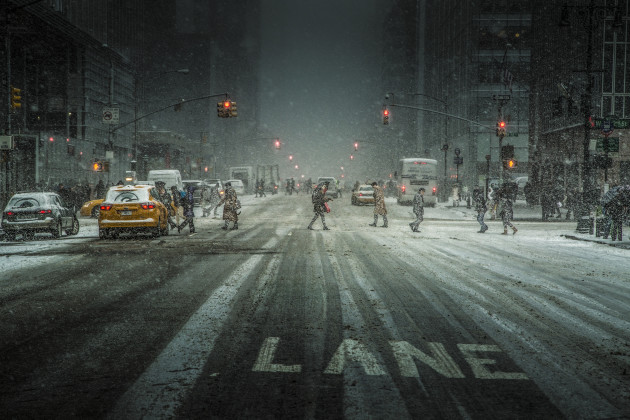 &copy; Ali Rajabi Shomali
2nd Prize &ndash; General category. This photo was taken on 6th Ave in Manhattan, New York City in January 2014. The photographer captured walking pedestrians as they crossed the road in freezing conditions. Although the red lights and cold weather indicate inactivity, the crossing pedestrians and their will to get to where they need to be, indicates the exact opposite.