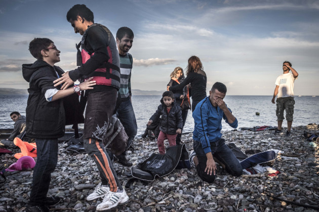 Relief and joy for a refugee family that survive a perilous journey by sea that for many others has unfortunately ended in tragedy. 3rd Prize - Happiness. &copy; Sergey Ponomarev (Russian Federation).