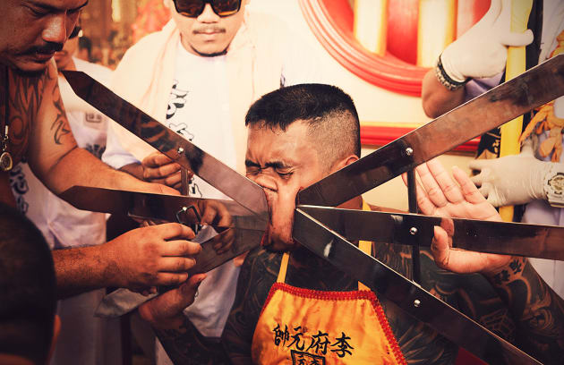 Masong. The 'Masong' (those who invite the spirits of the gods to possess their bodies) are rewarded by the nine gods by leaving few scars and drawing little blood despite the gruesome administered body modification.  A variety of rituals are performed at the temple so the gods can inhibit their bodies and they can practice by impaling the cheek, tongue and body piercings with 'little pain' or scarification.
&copy; Giselle Natassia, Australia, Commended, Open, Culture, 2017 Sony World Photography Awards.