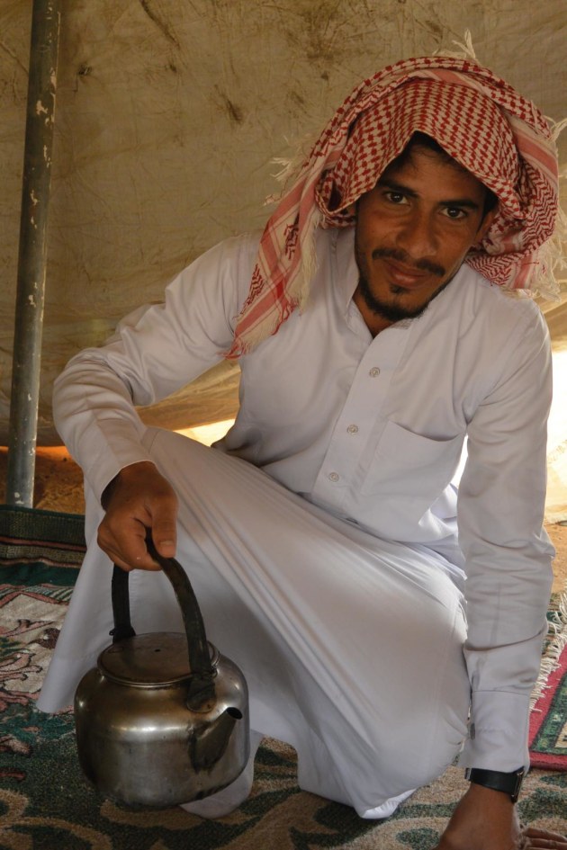Abu Sabbah's son offers tea at their Bedouin camp en route to Wadi Rum