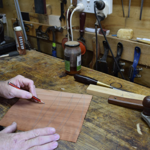 Mark the downside of the veneer with a soft pencil.