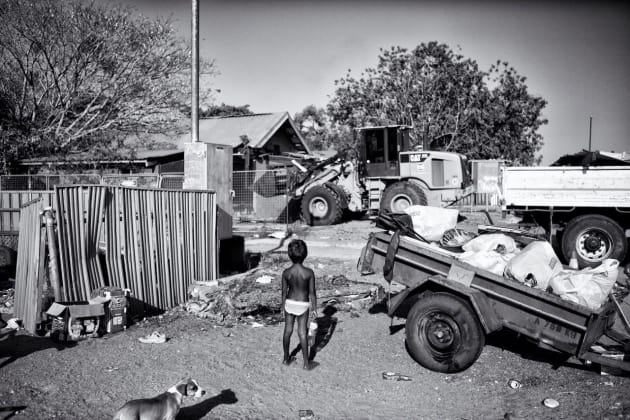 Meah, (5) standing outside her family home. Recently, the Premier of
Western Australia, Colin Barnett, committed to closing down approximately
150 remote Aboriginal Communities in WA. Kennedy Hill, Broome, Western Australia. 
&copy; Ingetje Tadros/Diimex.
