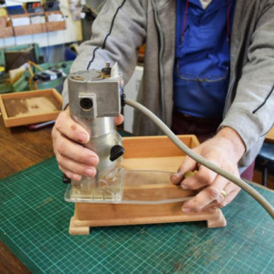 Showing Steve Hay's custom made palm router base in use.