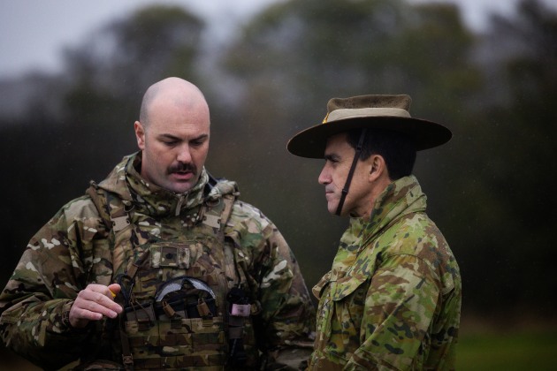 Chief of Army Lieutenant General Simon Stuart being briefed by Major Josh Sullivan (NZDF) on the training of Ukrainian recruits, as part of an international effort to train 10,000 Ukrainians. (Defence)