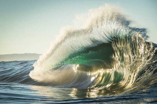 "This was taken off the back of my jetski at a wave here on Western Australia's South Coast. Water draws off a shallow reef shelf creating backwash which collides with an oncoming wave, exploding into a golden flare in the soft morning light."
&copy; Gordon Becker, Australia, Commended, Open, Nature, 2017 Sony World Photography Awards.