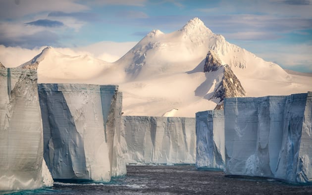 Tabular iceberg. "On our way to the 66 parallel south - in Antarctica - we are discovering a recent iceberg graveyard. A massive part (as large as a US state) of the Ice Shelf broke down few years ago due to global warming, displaying a splendid, but scary visual. Those icebergs are about 100 feet tall from the sea level, transporting big amount of fresh water, waiting to be dissolved in the ocean. The scene was magnificent, but also incredibly scary."
&copy; Josselin Cornou, France, Shortlist, Open, Nature, 2017 Sony World Photography Awards.