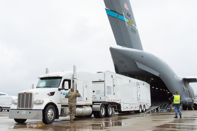 A Mobile Remote Quick Look trailer is marshalled onto a C-17A Globemaster III airlifter on 1 February. (US Air Force 436th Airlift Wing)