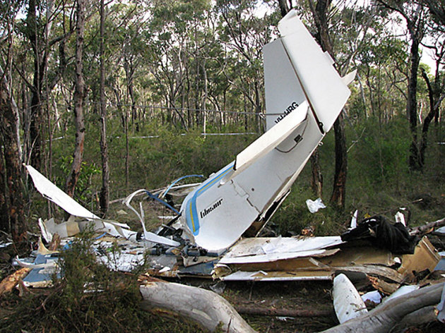 The crash site of Glasair VH-HRG at Wedderburn, NSW. Note the tail has been supported in this position by being tied to a tree. (ATSB)
