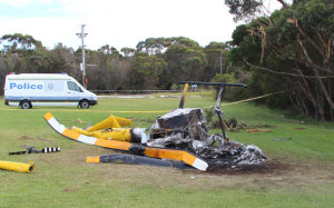 The R44 crash site at Bulli Tops. Note the broken tree branches at the top right. (ATSB)
