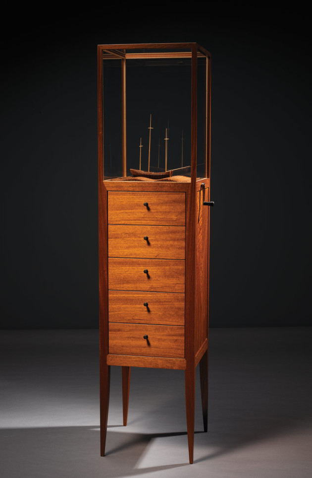 Adrian Potter, A Certain Maritime Affair, 2005, 1790 x 420 x 420. Australian red cedar, Huon pine, celery top pine, cedar of Lebanon, leatherwood, ebony, steel, brass, glass, HDPE, acetal, geared mechanism, chain drive. Waves and ship inspired by Dad&rsquo;s Clock, a film by Dik Jarman. Photo: Grant Hancock