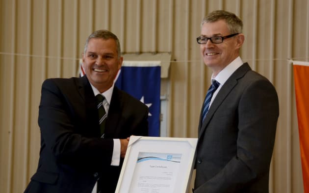 CASA Stakeholder Engagement Manager Rob Walker (left) hands the Airvan 10 type certificate to GippsAero CEO Keith Douglas. (Steve Hitchen)