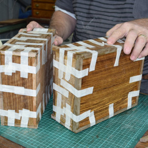 Masking tape is enough to keep things in place while gluing edges on these boxes.