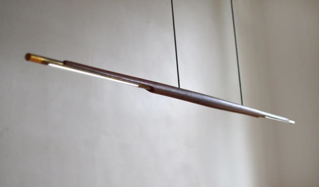 ADAM MARKOWITZ | VIC 
The Assegai Pendant blends sleek lines with subtly sculpted timber to create a contemporary LED pendant. The brass adds elegance and warmth, as well as diffusing the heat.