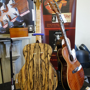 Display of guitars by Barry Kerr, Woodtone Guitars. The species of the highly figured back is black and white ebony. See www.woodtoneguitars.com.au