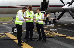 A  CASA Flight Operations Inspector works with a Metro crew. (CASA)