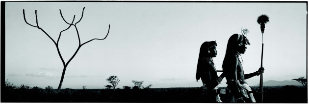 &copy; Chris Rainier. Masai Warriors, Savannah plains, East Africa.