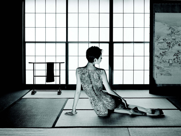 &copy; Chris Rainier. Japanese Ikuza woman with tattoo, Tokyo.